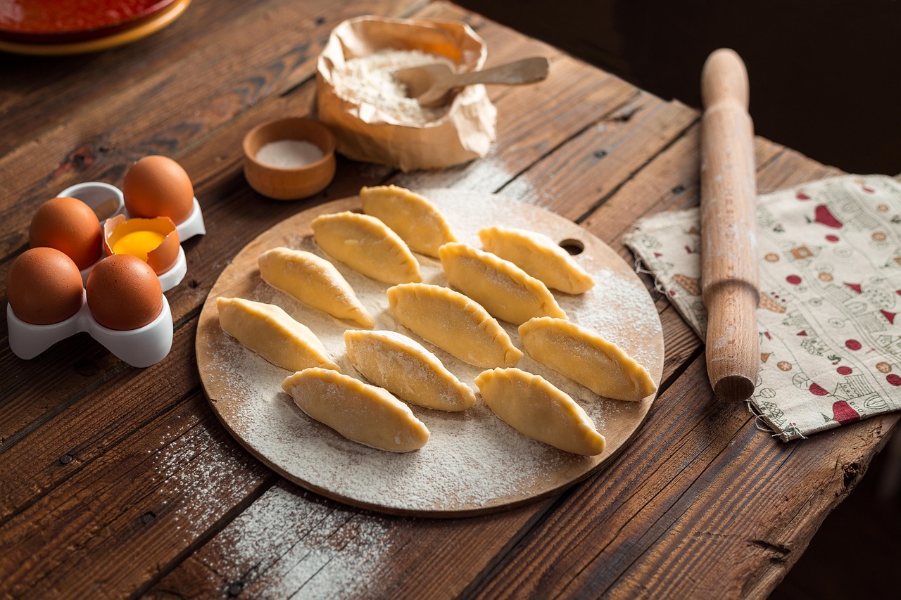 Dumplings, eggs, and ingredients on a table